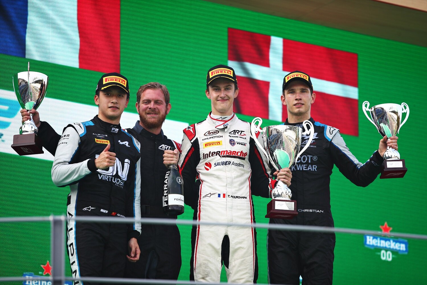 Theo Pourchaire, Gunayu Zhou, and Christian Lundgaard celebrate on the podium at Monza. (Formula Motorsport Limited)