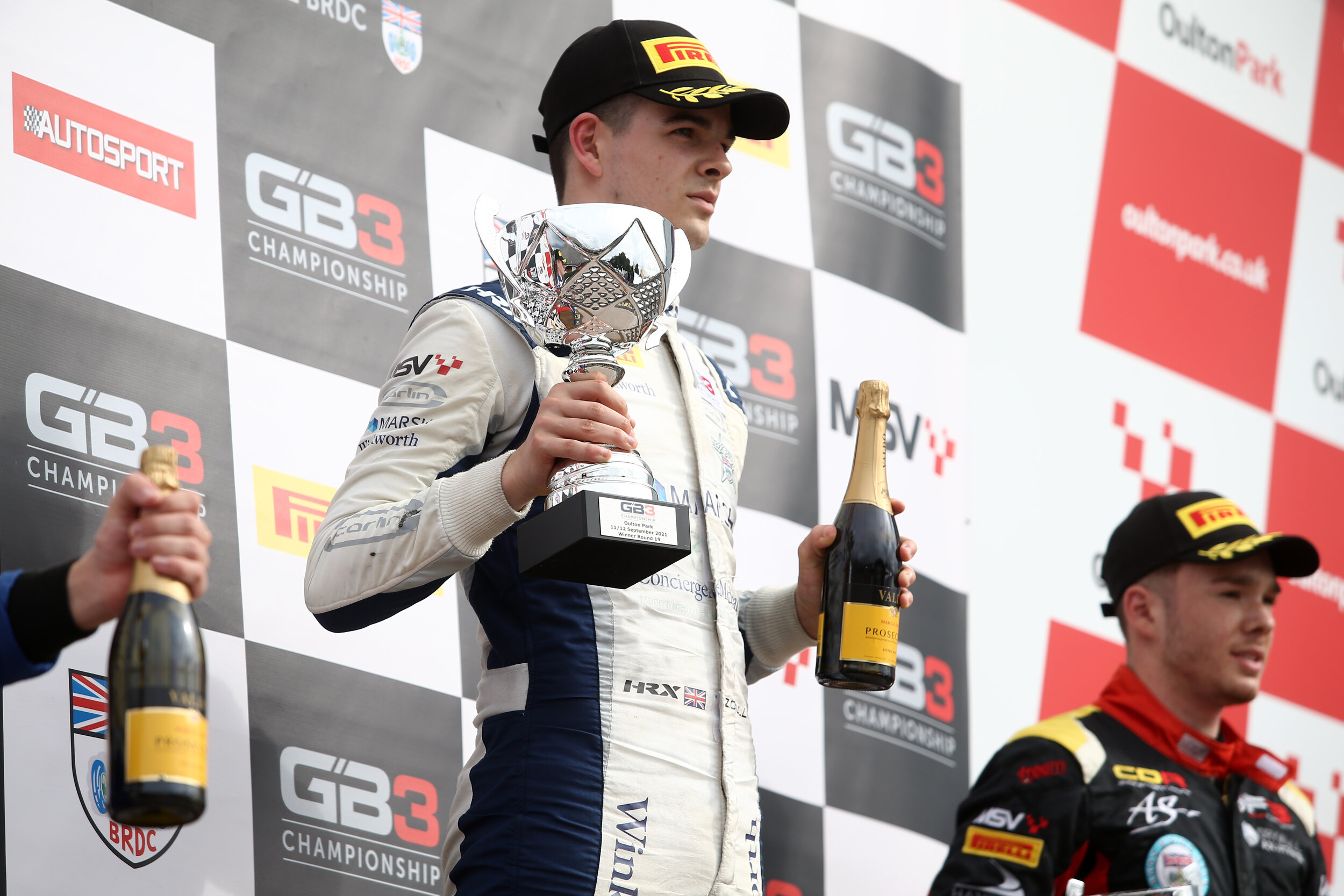 Carlin’s Zak O’Sullivan on the podium at Oulton Park. (Jakob Ebrey)